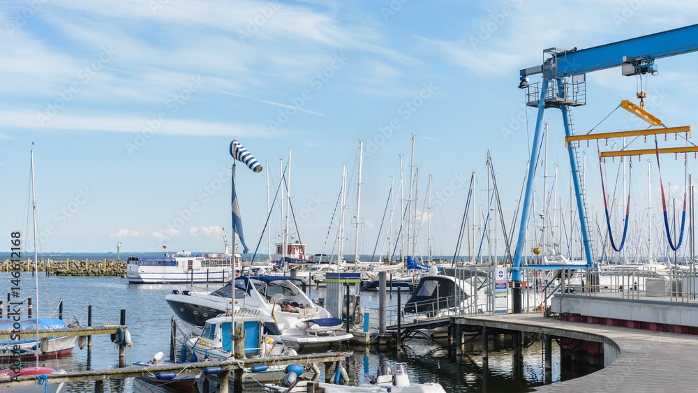 Ssailing yachts at a port of Baltic Sea. Yacht hoist. Northern Germany, coast of Baltic Sea