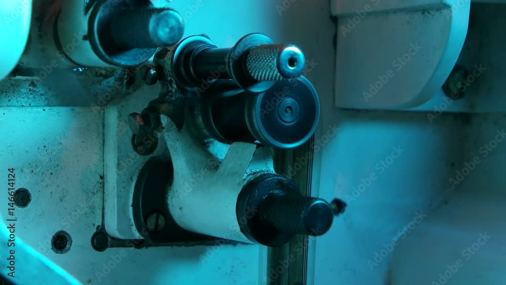 Close up of a classic old film projector in action

