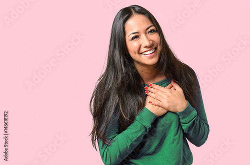 Young woman showing her heartfelt gratitude