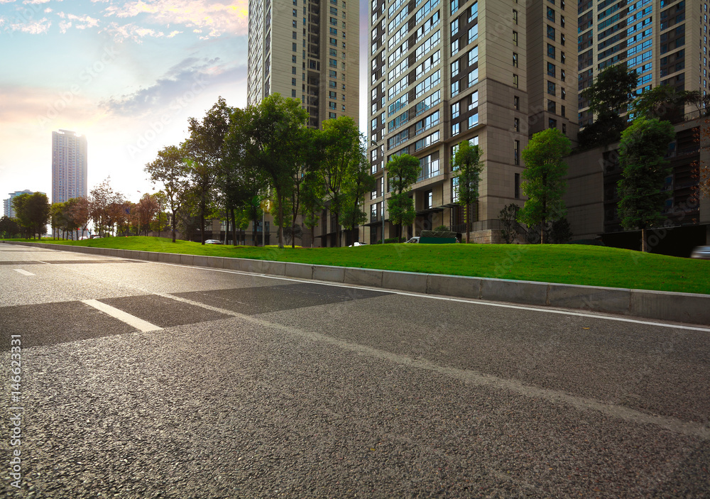 Empty road surface floor with City streetscape buildings Empty road surface floor with City streetscape buildings