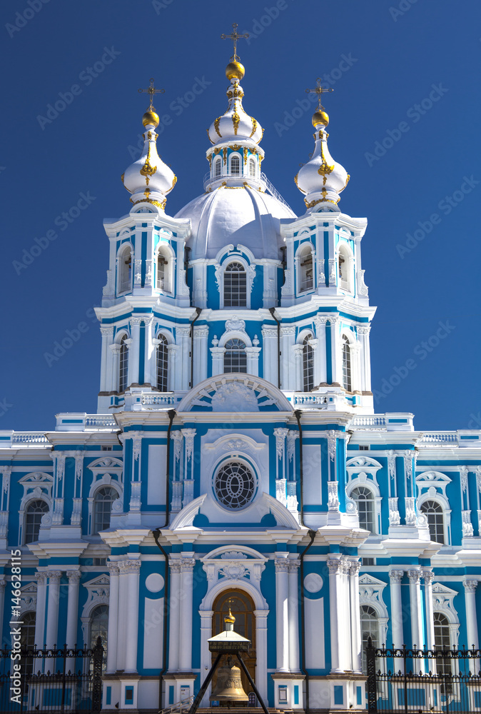 Russia, St. Petersburg. Smolny Cathedral (Church of the Resurrection). Cathedral facade. Clear blue sky.