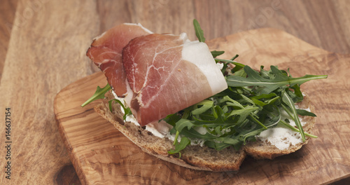 sandwich with italian speck, arugula and cream cheese, 4k photo