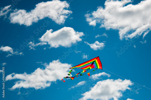 Kite flying against the background of clouds