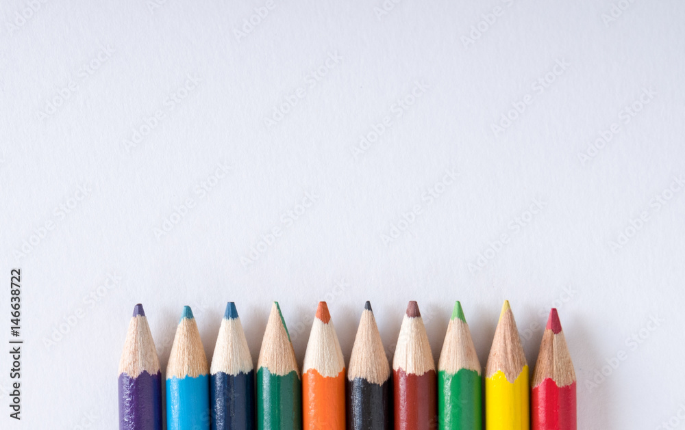Colored pencil on bottom center of blank white paper Colored pencil on bottom center of blank white paper