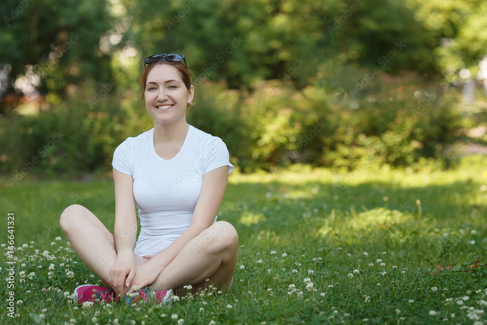 Young beautiful woman looking to camera - outdoor in nature. Young beautiful woman looking to camera - outdoor in nature.