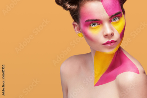 Fotografie Portrait of the bright beautiful girl with art colorful painting make-up and bodyart