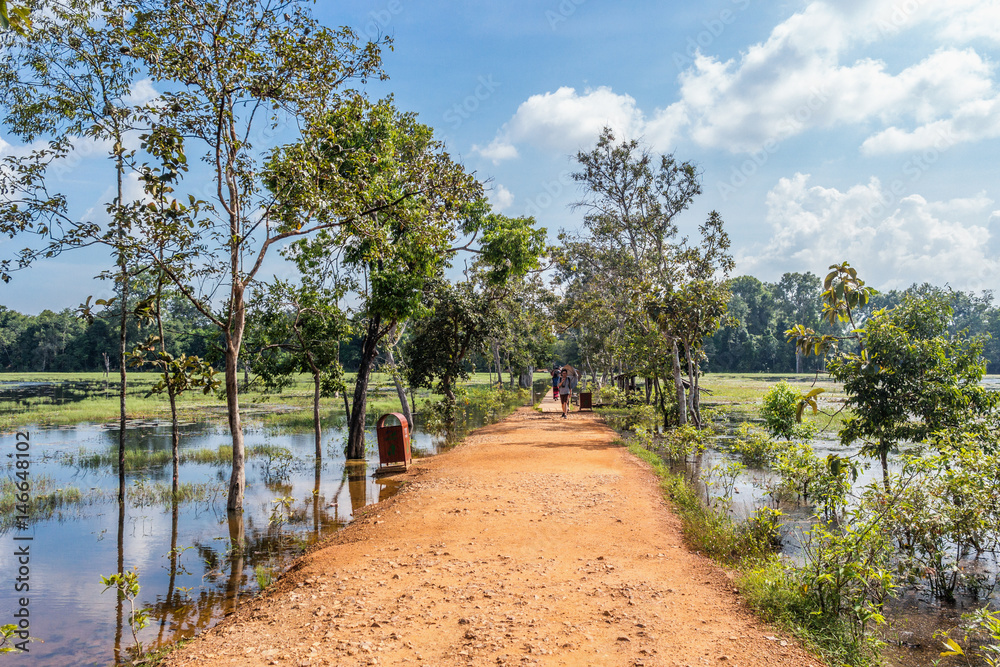 The path towards to Neak Pean temple on artificial island. Angkor.