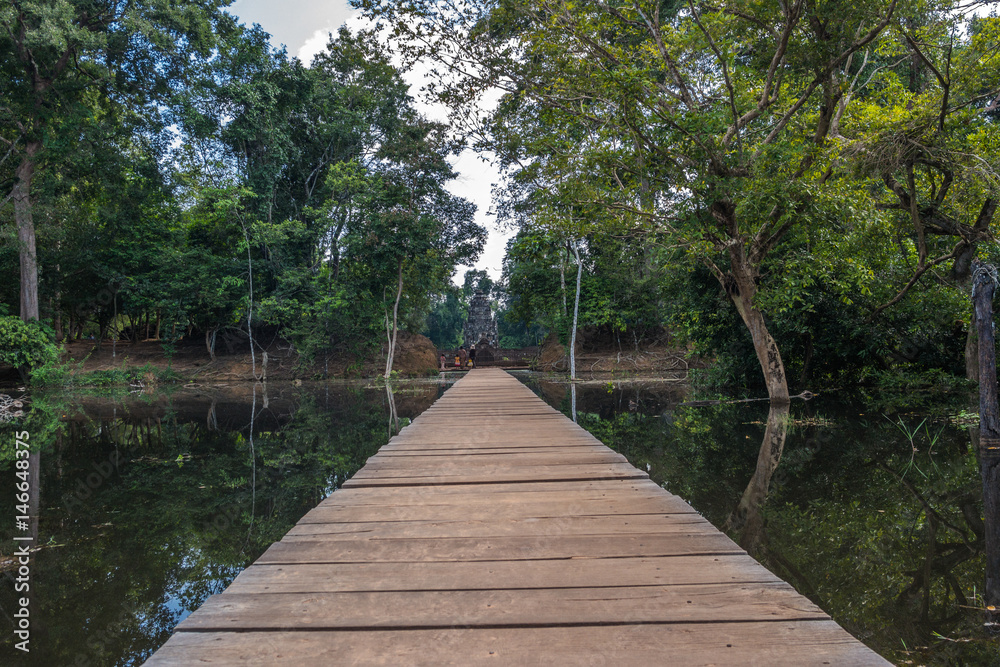 The path towards to Neak Pean temple on artificial island. Siem Reap, Cambodia The path towards to Neak Pean temple on artificial island. Siem Reap, Cambodia