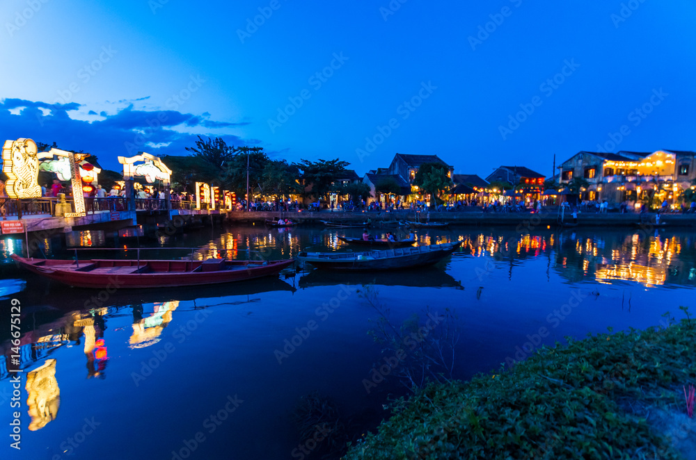 Hoi An city lights across the Thu Bon river in Vietnam