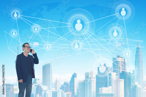 Businessman with smart city and wifi wireless internet.icons communication network background.