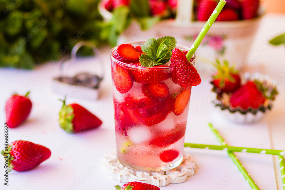 Homemade strawberry lemonade with mint on a white background Homemade strawberry lemonade with mint on a white background