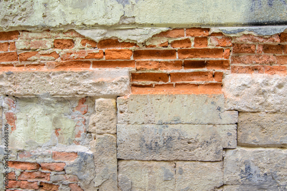 Fototapeta premium cracked concrete vintage brick wall background. Part of the stone wall, stone wall background texture