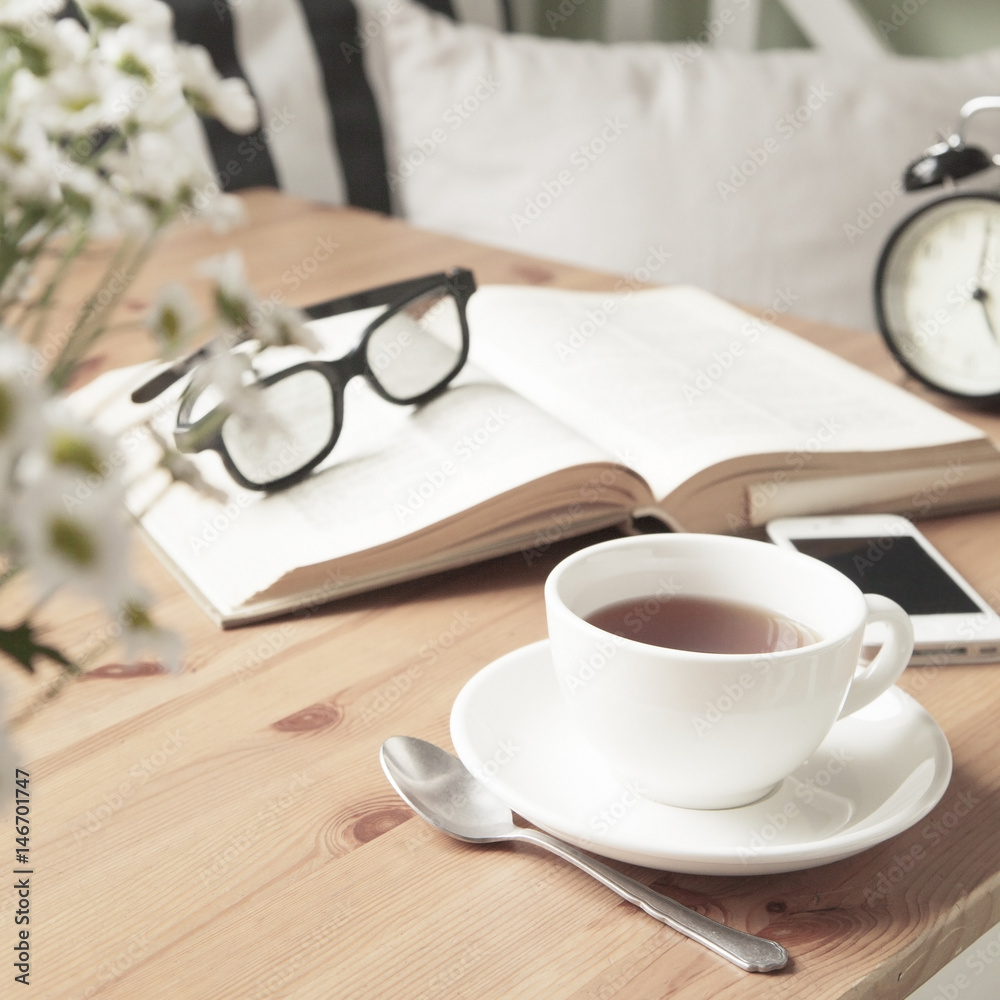 Composition with tea cup and book. Composition with tea cup and book.