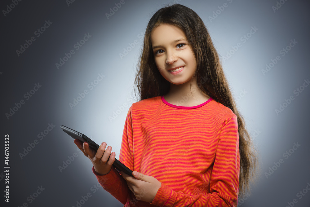 smiling young girl or teenager with tablet pc computer