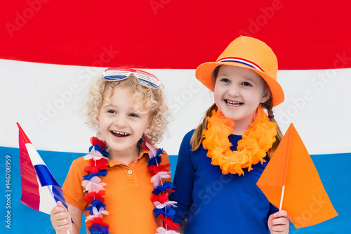 Dutch kids. Children with flag of Netherlands. Holland fans