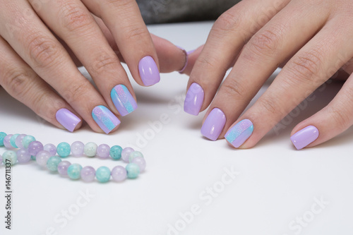 Attractive women s hands. Natural nails with beautiful manicure.