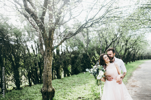  Loves and very happy groom and bride in the park photo