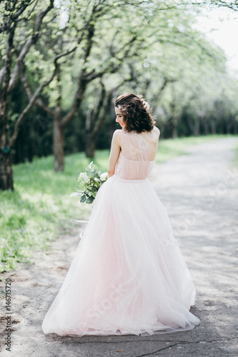 Portrait of beautiful bride in the park