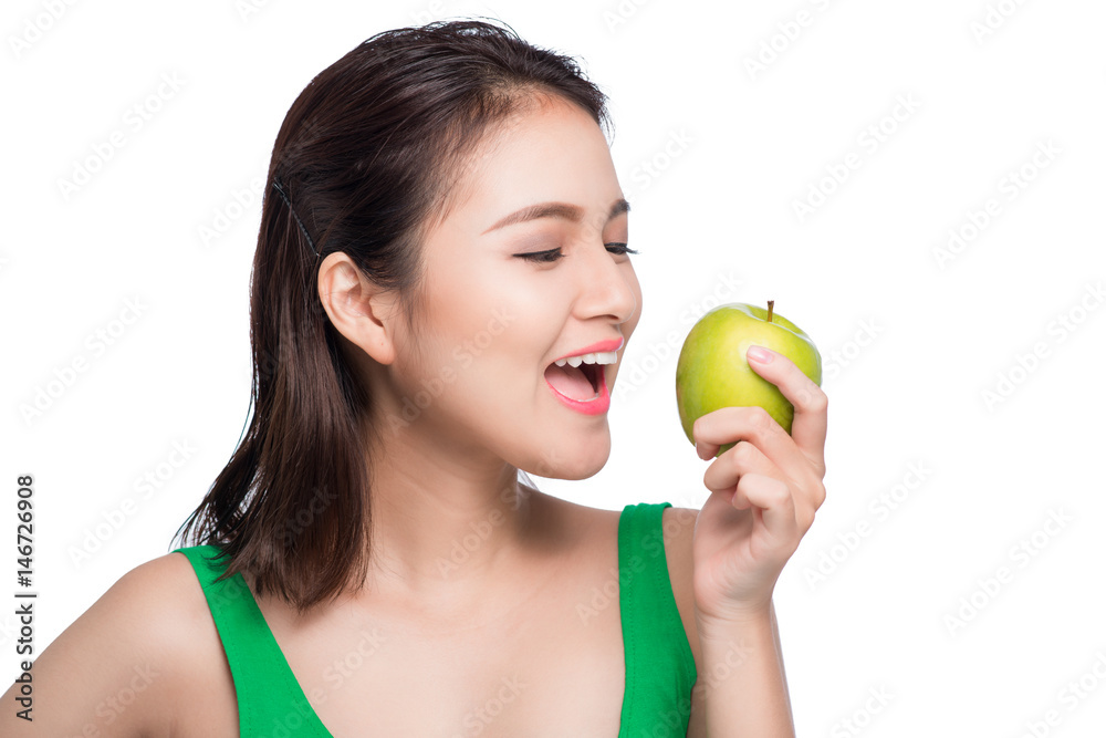 Young beautiful asian woman eating fresh green apple on white background Young beautiful asian woman eating fresh green apple on white background