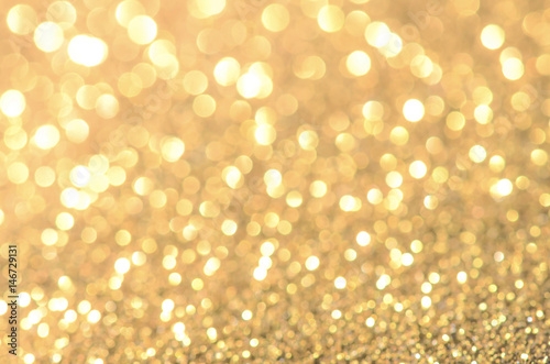 Gold abstract background with bokeh.