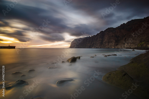 Dynamic and dramatic sunset over Los Gigantes Cliffs in Tenerife