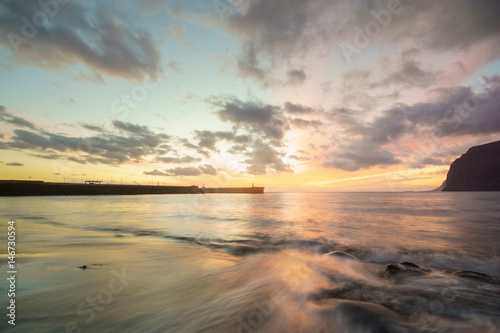 Dynamic and dramatic sunset over Los Gigantes Cliffs in Tenerife