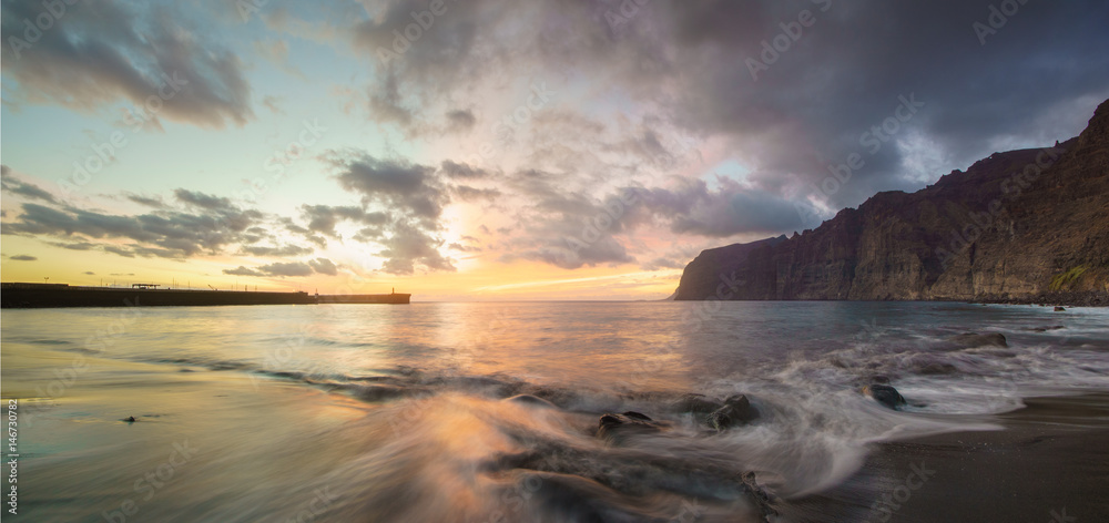 Dynamic and dramatic sunset over Los Gigantes Cliffs in Tenerife