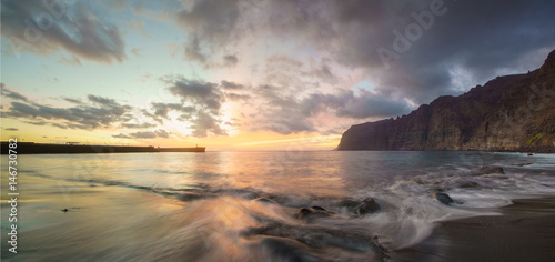 Dynamic and dramatic sunset over Los Gigantes Cliffs in Tenerife