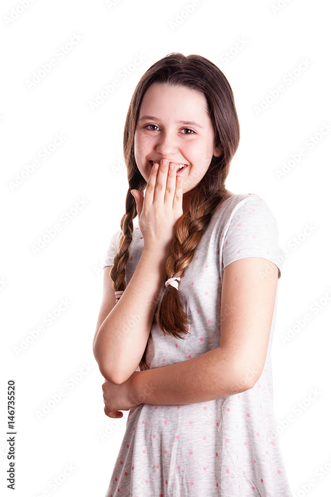 Young teenager girl giggling with her arm in front of mouth over the white background Young teenager girl giggling with her arm in front of mouth over the white background