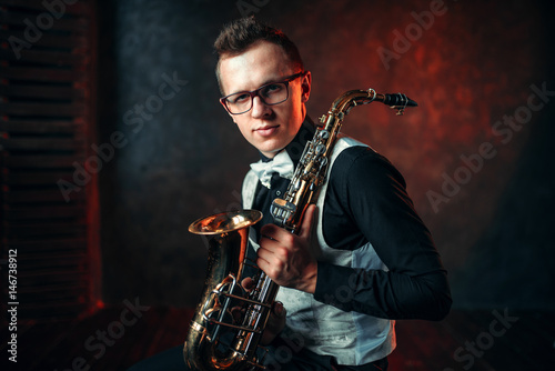 Male saxophonist with saxophone, jazz man with sax