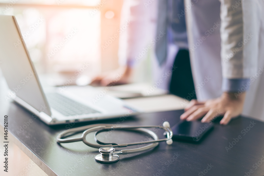 Doctor working at office desk Doctor working at office desk
