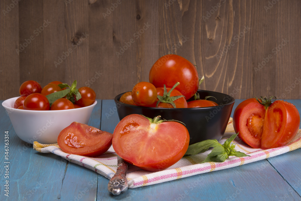 Fresh tomatoes on rustic wooden background Fresh tomatoes on rustic wooden background