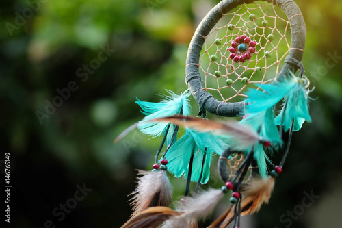 Soft focus and blurred Dream Catcher Blue Coral with natural background in vintage style. boho chic, ethnic amulet. photo