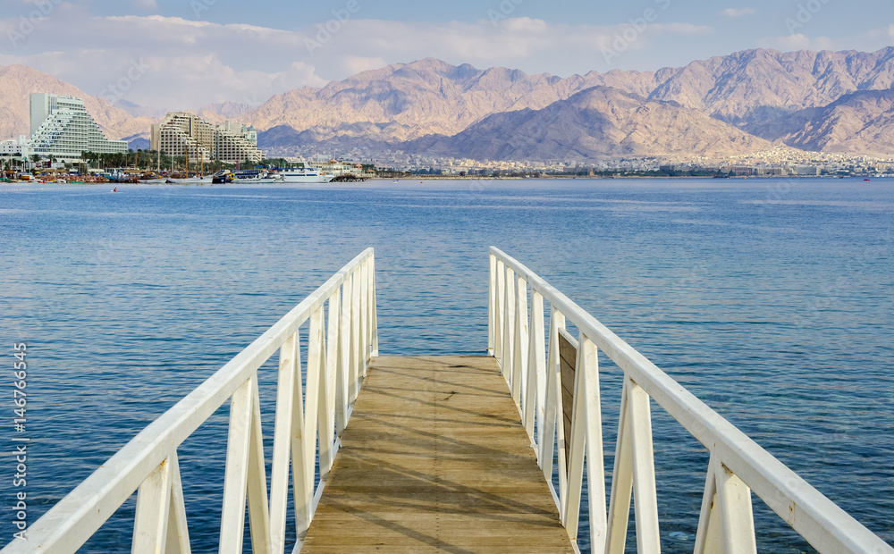 Footpath and view the Red Sea at central beach of Eilat - famous resort and recreational city in Israel