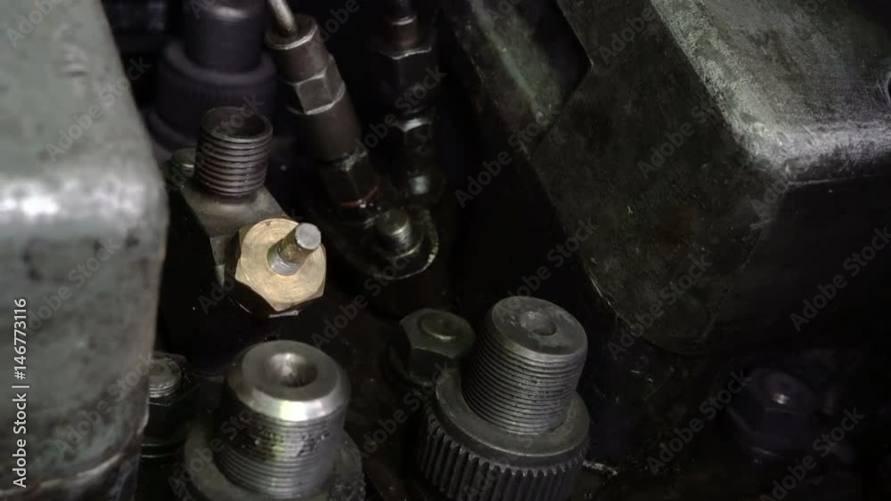 Hands master unscrew a large nut. Diesel locomotive garage. Train maintenance shop. Hands master unscrew a large nut. Diesel locomotive garage. Train maintenance shop.