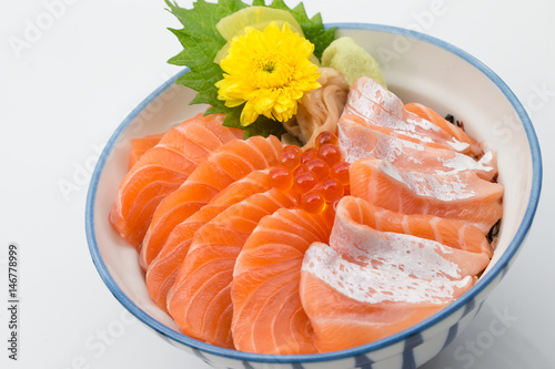 Rice with fresh salmon in bowl