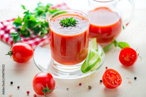 Wallpaper Mural tomato juice in glass, jug with greenery, basil, cutted tomato fruit and dry pepper on light table, concept healthy eating, close up Torontodigital.ca