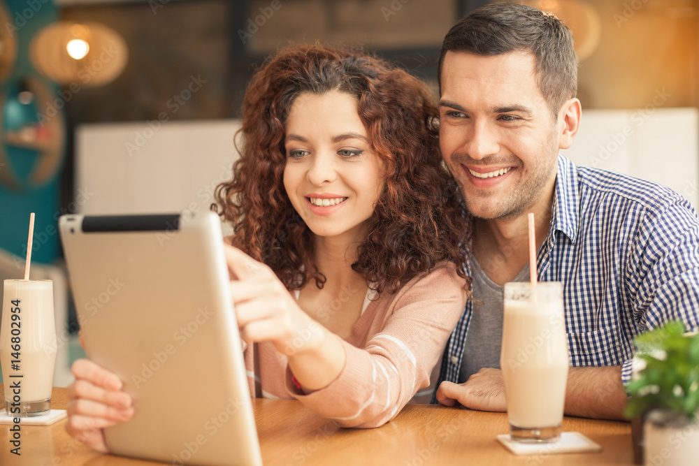 Nice looking couple in cafe