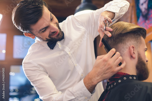 Young Man in Barber Shop Hair Care Service Concept