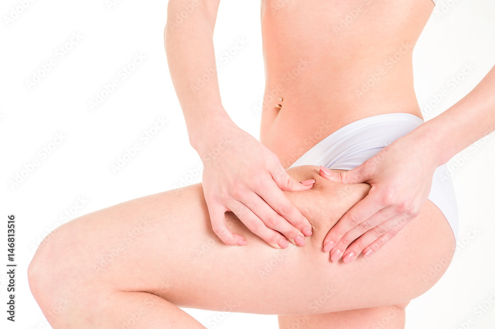 health, people, bodycare and beauty concept, closeup of woman buttocks with hands testing the skin for stretch marks and cellulite