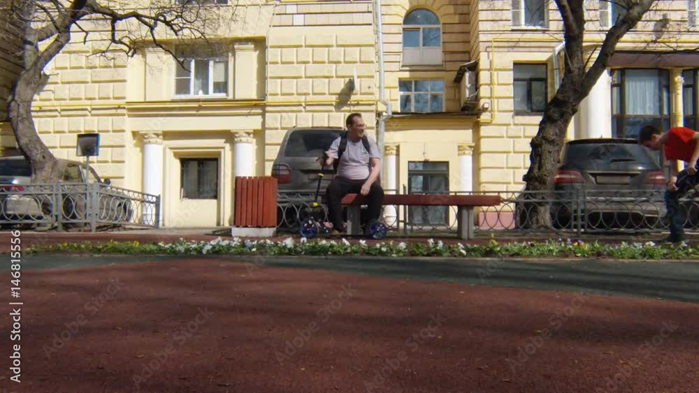 Family riding a scooter in a park, for a healthy lifestyle. Family riding a scooter in a park, for a healthy lifestyle.