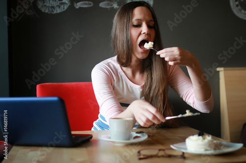 girl in a cafe for a cup of coffee with the notebook