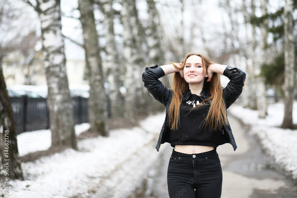 Young cute girl on a walk in the city