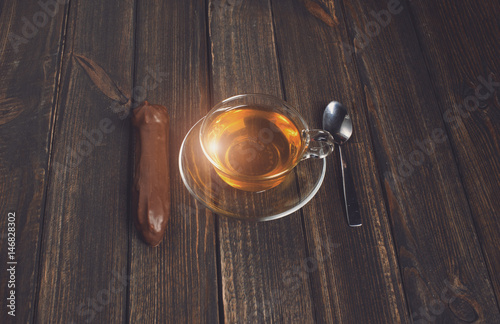 cake with tea on wooden desk
