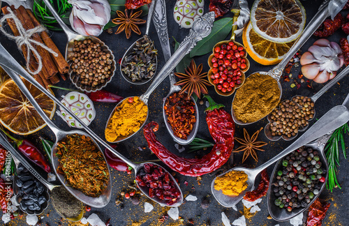 Spices and herbs in metal bowls. Food and cuisine ingredients. Colorful natural additives.