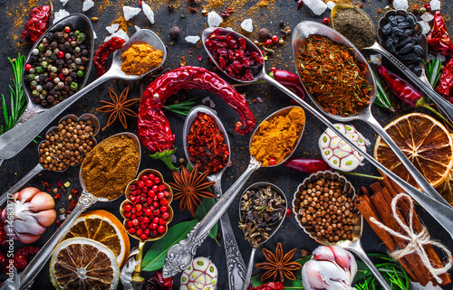 Fototapeta Naklejka Na Ścianę i Meble -  Spices and herbs in metal bowls. Food and cuisine ingredients. Colorful natural additives.