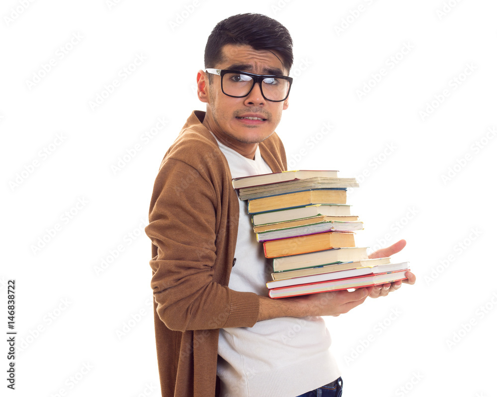 Young man in glasses with books Young man in glasses with books