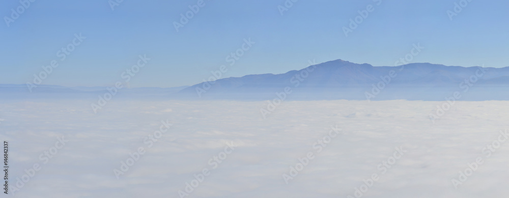mountain landscape with waves of fog, aerial pov mountain landscape with waves of fog, aerial pov