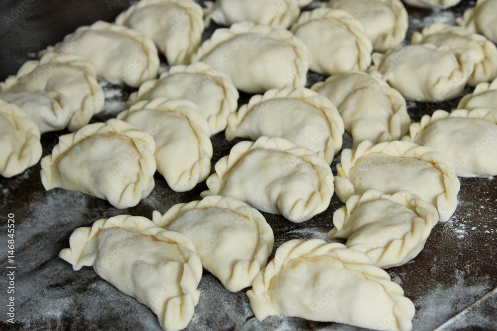 Dumplings on the dark kitchen board Dumplings on the dark kitchen board