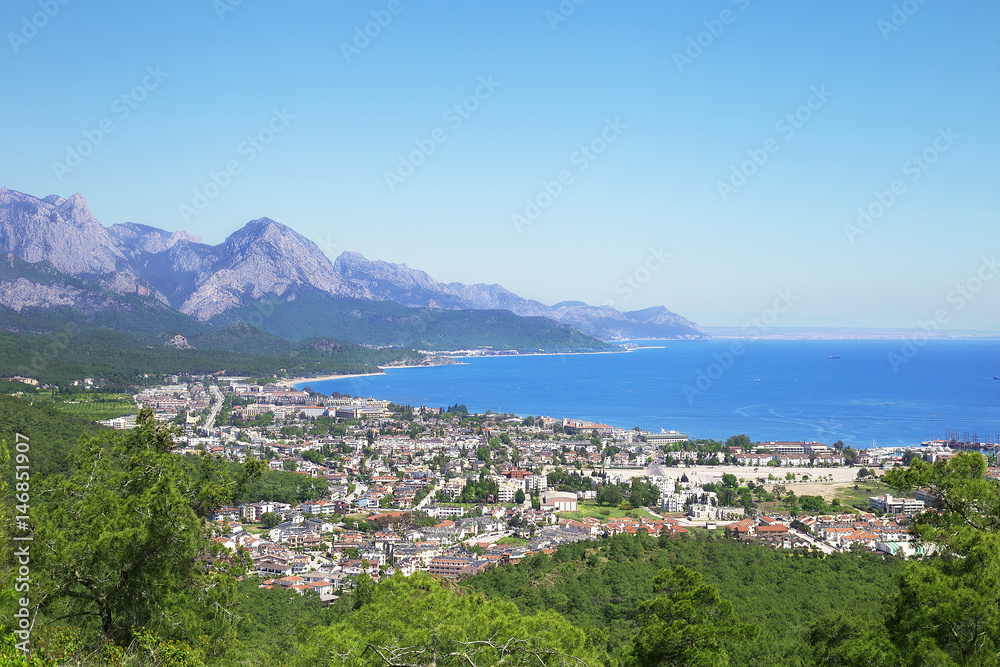 View of the town of Kemer from the top of the mountain. Blue sea, sky, mountains and city. Turkey